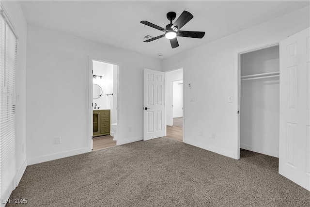 1108 Putnam Ave, North Las Vegas, NV 89030 - unfurnished bedroom featuring carpet floors, a closet, ensuite bathroom, and ceiling fan