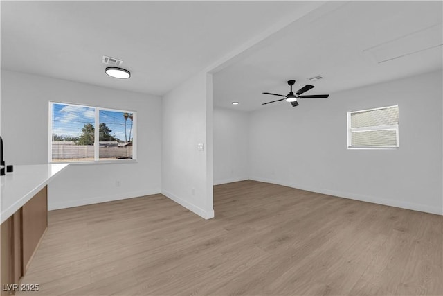 1108 Putnam Ave, North Las Vegas, NV 89030 - unfurnished living room featuring light wood-style floors and ceiling fan