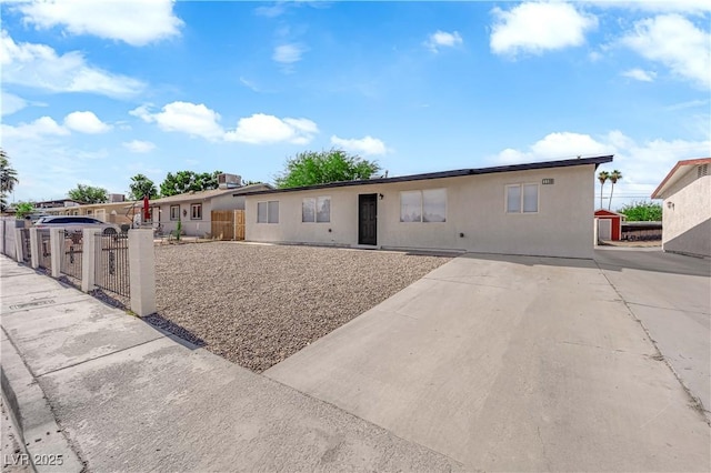 1108 Putnam Ave, North Las Vegas, NV 89030 - ranch-style home featuring a fenced front yard and stucco siding