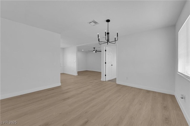 1108 Putnam Ave, North Las Vegas, NV 89030 - unfurnished living room featuring a chandelier, light wood finished floors, and a ceiling fan