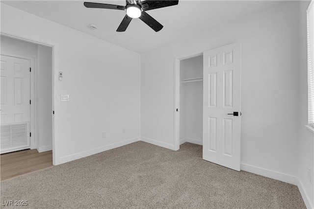 1108 Putnam Ave, North Las Vegas, NV 89030 - unfurnished bedroom featuring light carpet, a closet, and a ceiling fan