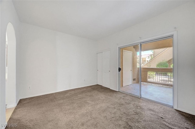 900 Heavenly Hills Ct Unit 114, Las Vegas, NV 89145 - unfurnished room featuring carpet flooring and arched walkways