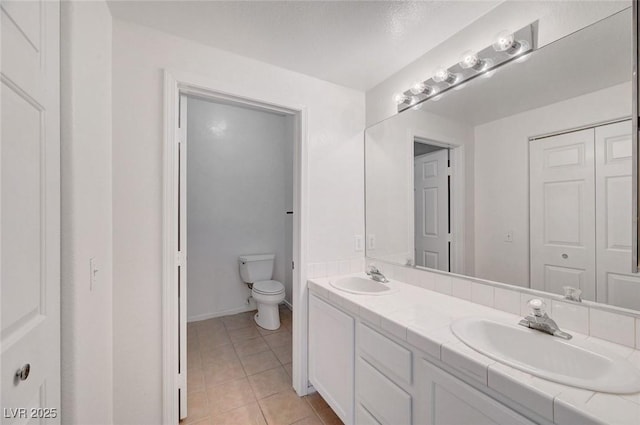 900 Heavenly Hills Ct Unit 114, Las Vegas, NV 89145 - bathroom featuring double vanity and tile patterned floors