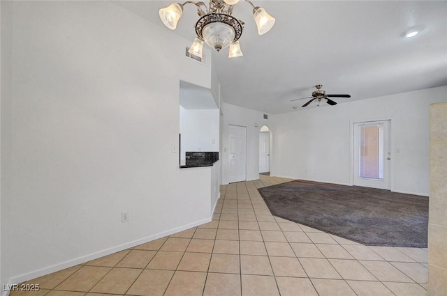 900 Heavenly Hills Ct Unit 114, Las Vegas, NV 89145 - unfurnished room with arched walkways, a chandelier, light tile patterned flooring, and ceiling fan