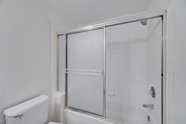 900 Heavenly Hills Ct Unit 114, Las Vegas, NV 89145 - bathroom featuring toilet and bath / shower combo with glass door
