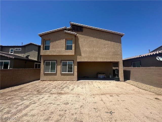 7636 Bandon Cliffs St, North Las Vegas, NV 89084 - back of property featuring stucco siding and a fenced backyard