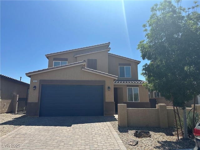 7636 Bandon Cliffs St, North Las Vegas, NV 89084 - view of front of property with stucco siding, an attached garage, and decorative driveway