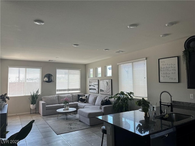 7636 Bandon Cliffs St, North Las Vegas, NV 89084 - living room featuring light tile patterned floors and recessed lighting