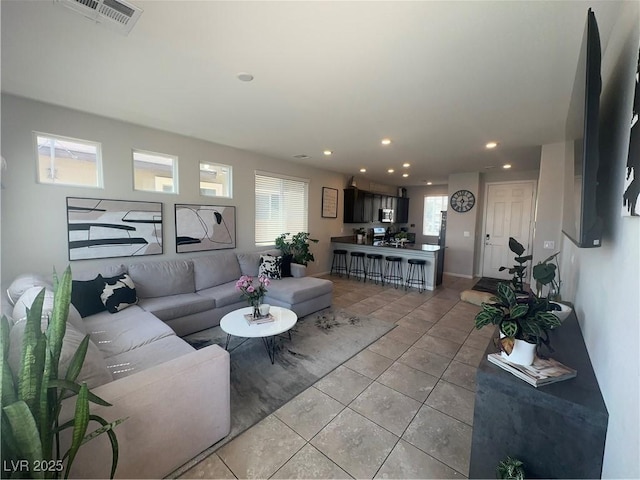 7636 Bandon Cliffs St, North Las Vegas, NV 89084 - living room with light tile patterned floors and recessed lighting