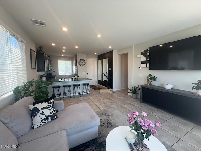 7636 Bandon Cliffs St, North Las Vegas, NV 89084 - living area with light tile patterned flooring and recessed lighting