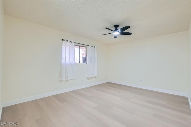 4683 Monterey Cir Unit 4, Las Vegas, NV 89169 - spare room featuring light wood-type flooring, ceiling fan, and a textured ceiling