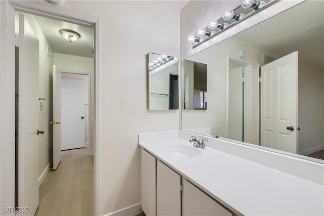 4683 Monterey Cir Unit 4, Las Vegas, NV 89169 - bathroom with vanity and wood finished floors