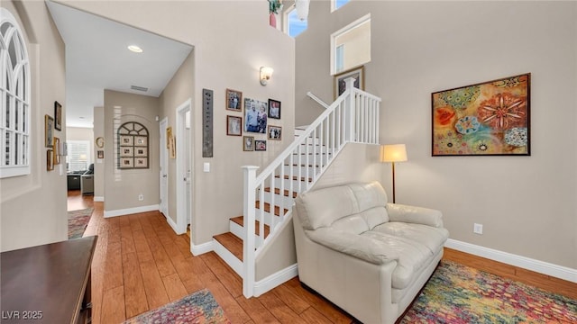 8139 Skytop Ledge Ave, Las Vegas, NV 89178 - staircase featuring hardwood / wood-style flooring and recessed lighting