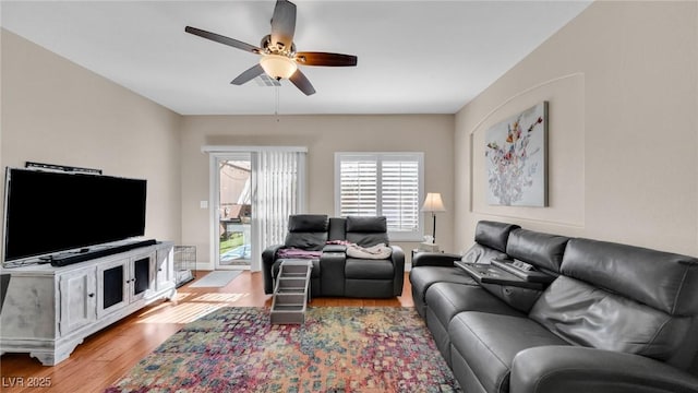 8139 Skytop Ledge Ave, Las Vegas, NV 89178 - living area featuring a ceiling fan and light wood finished floors