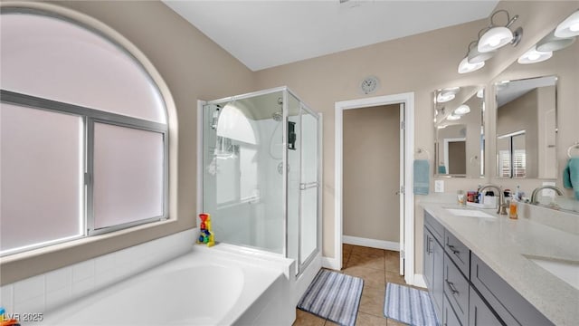 8139 Skytop Ledge Ave, Las Vegas, NV 89178 - full bathroom with a shower stall, double vanity, a garden tub, and tile patterned flooring