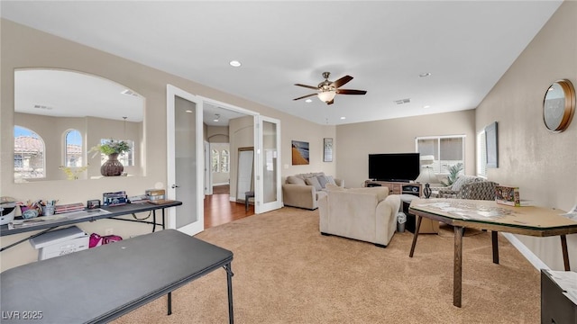 8139 Skytop Ledge Ave, Las Vegas, NV 89178 - living room featuring light colored carpet, a ceiling fan, recessed lighting, and arched walkways