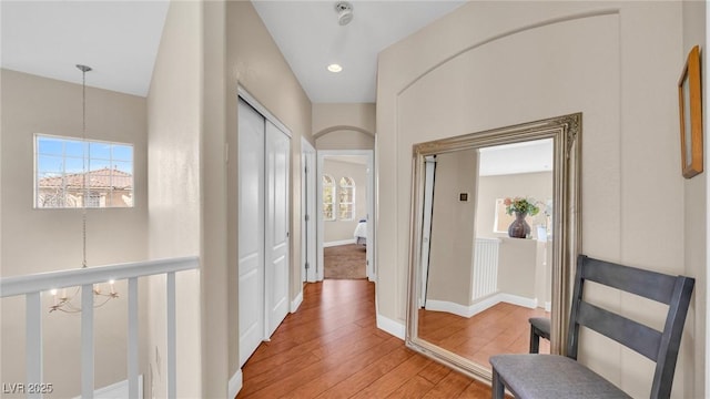 8139 Skytop Ledge Ave, Las Vegas, NV 89178 - hall with a chandelier and light wood-type flooring
