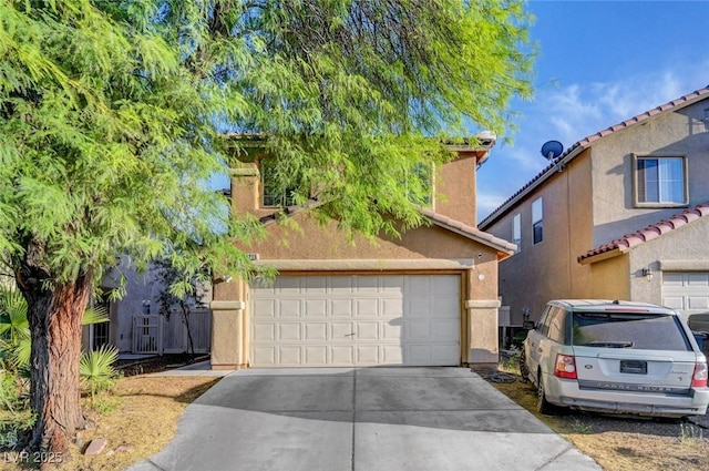 4215 Macadamia Dr, Las Vegas, NV 89115 - view of front of home with driveway and stucco siding