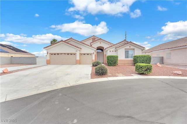 5505 Verbena Creek Ct, Las Vegas, NV 89131 - mediterranean / spanish-style house featuring concrete driveway, a garage, and stucco siding