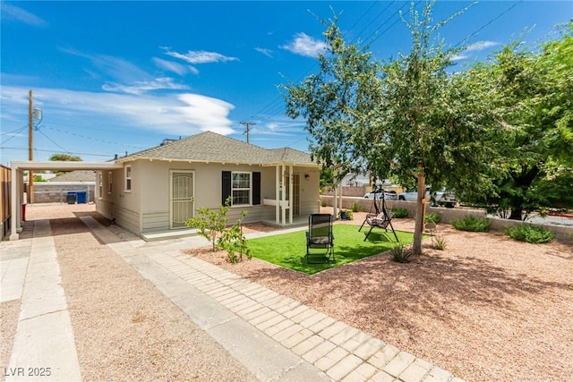 531 New Mexico St, Boulder City, NV 89005 - view of front facade featuring an attached carport, stucco siding, roof with shingles, and driveway