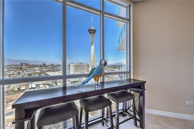 200 W Sahara Ave Unit 2210, Las Vegas, NV 89102 - dining area with baseboards and a view of city