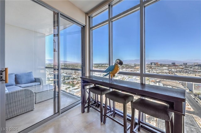 200 W Sahara Ave Unit 2210, Las Vegas, NV 89102 - sunroom / solarium featuring healthy amount of natural light and a city view