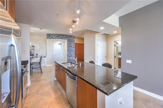 200 W Sahara Ave Unit 2210, Las Vegas, NV 89102 - kitchen featuring appliances with stainless steel finishes, brown cabinets, an island with sink, modern cabinets, and recessed lighting