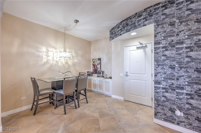 200 W Sahara Ave Unit 2210, Las Vegas, NV 89102 - dining area with baseboards and a chandelier