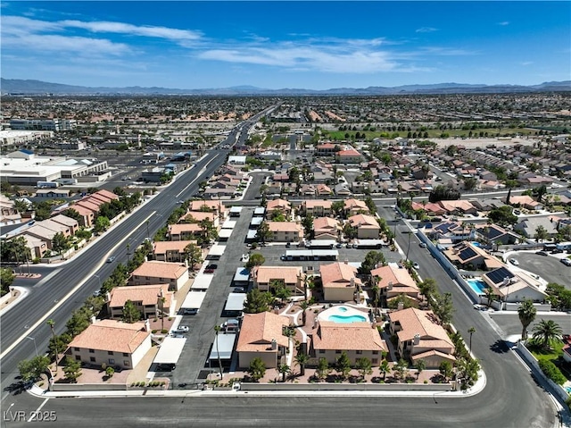 1201 N Buffalo Dr Unit 202, Las Vegas, NV 89128 - aerial perspective of suburban area featuring mountains and a pool