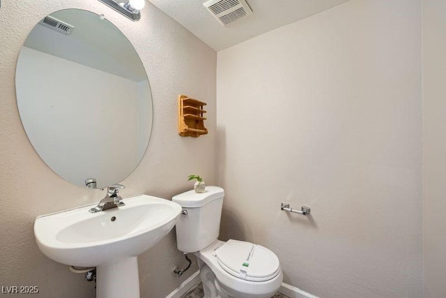 10719 Tottenham Ave, Las Vegas, NV 89135 - half bathroom featuring baseboards and toilet