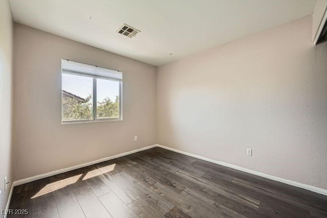10719 Tottenham Ave, Las Vegas, NV 89135 - spare room with baseboards and dark wood finished floors