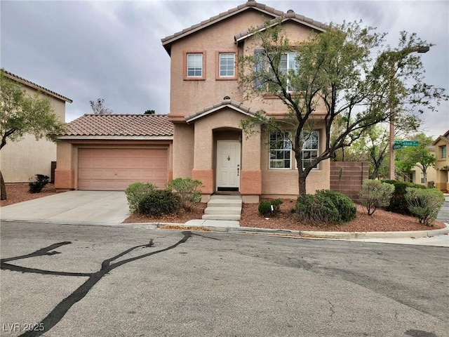 10719 Tottenham Ave, Las Vegas, NV 89135 - view of front of home featuring stucco siding, a tile roof, concrete driveway, and an attached garage