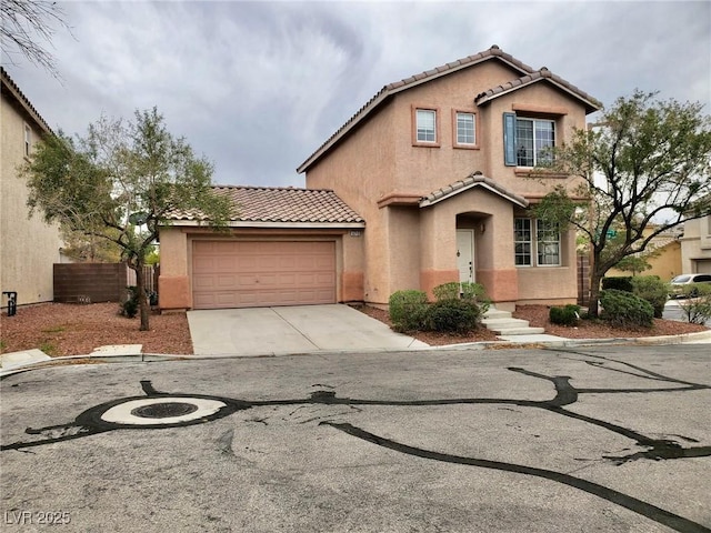 10719 Tottenham Ave, Las Vegas, NV 89135 - view of front of home featuring concrete driveway, a tile roof, stucco siding, and a garage