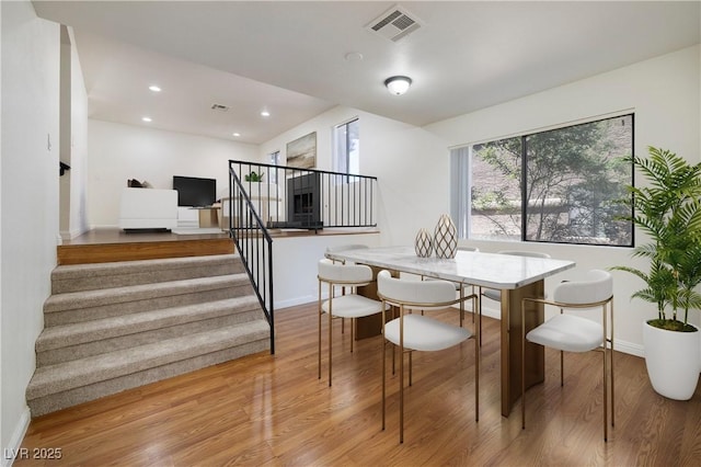 3972 Tirana Way, Las Vegas, NV 89103 - dining space with stairway, light wood-style floors, and recessed lighting