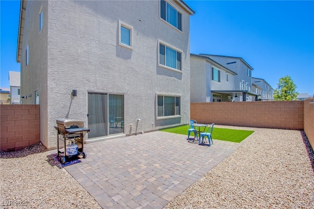 10435 Rose Palisade St, Las Vegas, NV 89141 - rear view of property featuring stucco siding, a fenced backyard, and a patio area