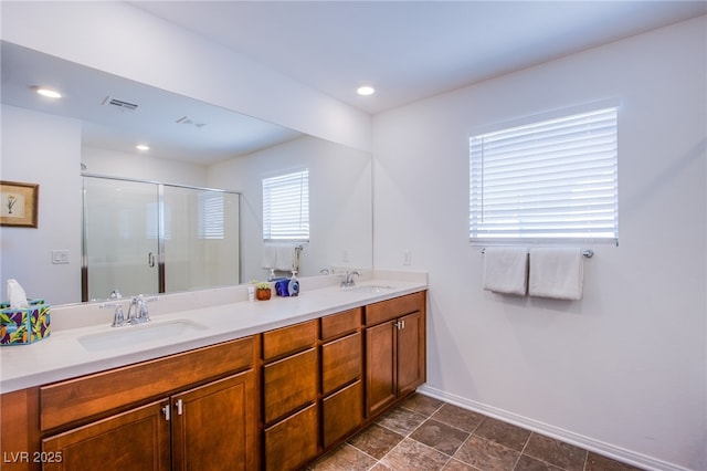 10435 Rose Palisade St, Las Vegas, NV 89141 - bathroom featuring a shower stall, double vanity, and recessed lighting