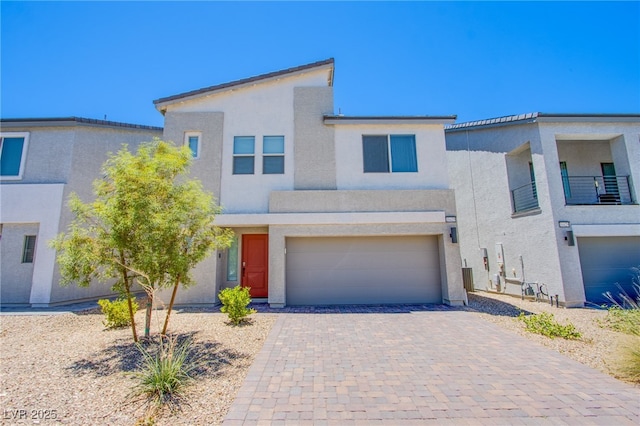 10435 Rose Palisade St, Las Vegas, NV 89141 - view of front facade with stucco siding, a garage, and decorative driveway
