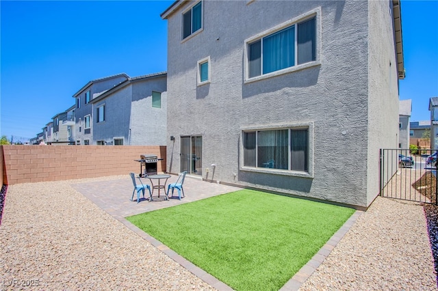 10435 Rose Palisade St, Las Vegas, NV 89141 - back of house with stucco siding, a patio, a fenced backyard, and a residential view