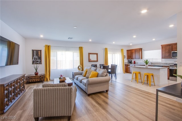10435 Rose Palisade St, Las Vegas, NV 89141 - living room featuring recessed lighting and light wood finished floors