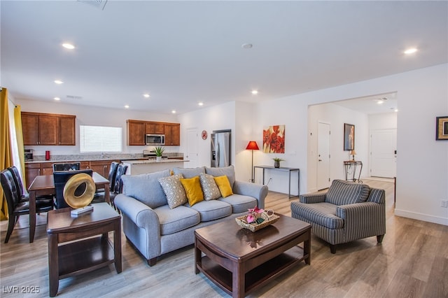 10435 Rose Palisade St, Las Vegas, NV 89141 - living area featuring light wood-style floors and recessed lighting
