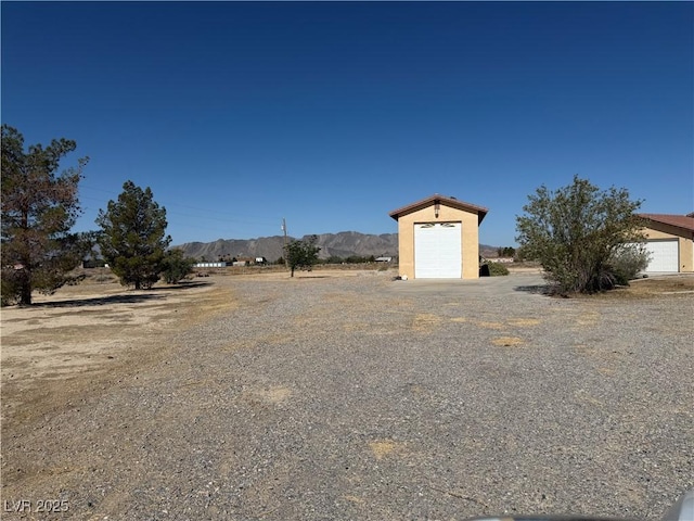 3090 N Woodchips Rd, Pahrump, NV 89060 - view of yard with a mountain view
