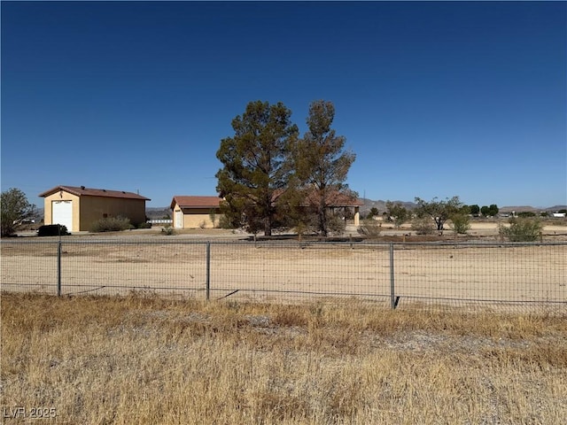 3090 N Woodchips Rd, Pahrump, NV 89060 - view of yard featuring a garage