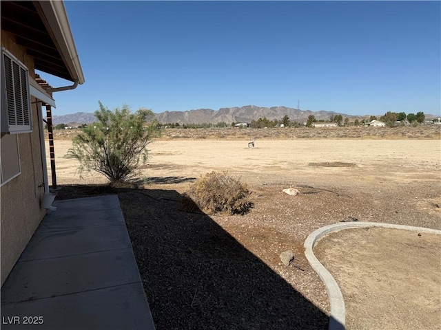 3090 N Woodchips Rd, Pahrump, NV 89060 - view of yard featuring a mountain view