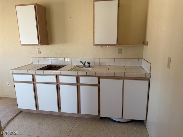 3090 N Woodchips Rd, Pahrump, NV 89060 - kitchen featuring tile countertops and white cabinetry