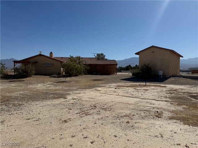 3090 N Woodchips Rd, Pahrump, NV 89060 - view of yard featuring a mountain view
