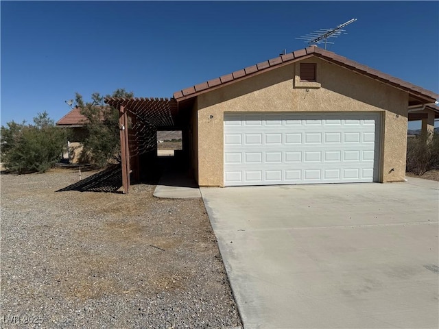 3090 N Woodchips Rd, Pahrump, NV 89060 - view of front of home featuring stucco siding and driveway