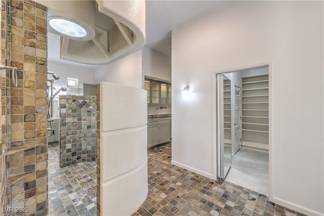 2017 Slow Wind St, Las Vegas, NV 89134 - bathroom featuring a tile shower and a spacious closet
