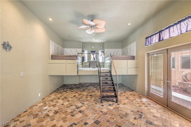 2017 Slow Wind St, Las Vegas, NV 89134 - bedroom featuring access to exterior, recessed lighting, french doors, stone finish floors, and a ceiling fan