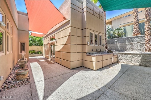 2017 Slow Wind St, Las Vegas, NV 89134 - view of patio featuring an outdoor kitchen and french doors
