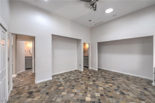 2017 Slow Wind St, Las Vegas, NV 89134 - unfurnished bedroom featuring a high ceiling and connected bathroom